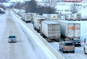 Highway shutdown - trucks bumper to bumper - McAll.com